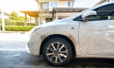 Side view of white car with dirty car mud stain - Southern Harvest Cheap homeowners in Georgia.