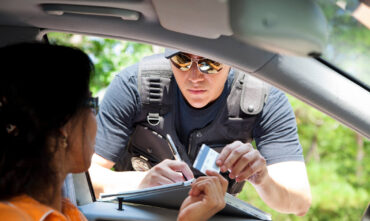 Police officer asking for driving license - Southern Harvest Cheap homeowners in Georgia.