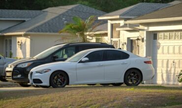 Two cars in front of a garage - Southern Harvest Cheap homeowners in Georgia.